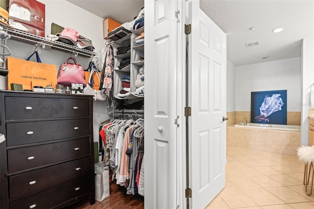 3805 Gulf Blvd Unit 404, St Pete Beach, FL 33706 - walk in closet featuring tile patterned flooring