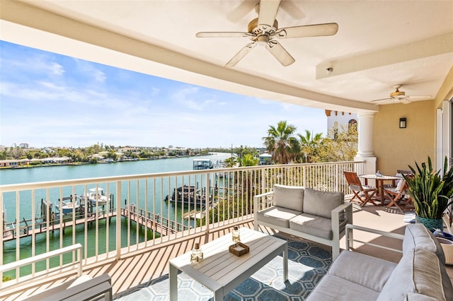 3805 Gulf Blvd Unit 404, St Pete Beach, FL 33706 - balcony featuring ceiling fan, an outdoor hangout area, and a water view