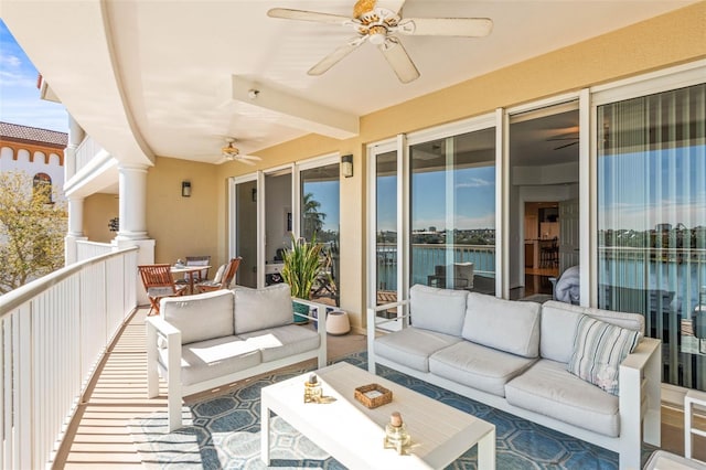 3805 Gulf Blvd Unit 404, St Pete Beach, FL 33706 - balcony with ceiling fan, outdoor lounge area, and outdoor dining space