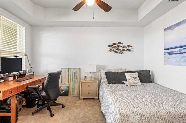 3805 Gulf Blvd Unit 404, St Pete Beach, FL 33706 - bedroom featuring light colored carpet, an office area, a ceiling fan, and a raised ceiling