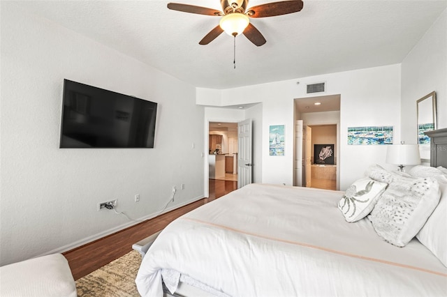 3805 Gulf Blvd Unit 404, St Pete Beach, FL 33706 - bedroom featuring wood finished floors and a ceiling fan