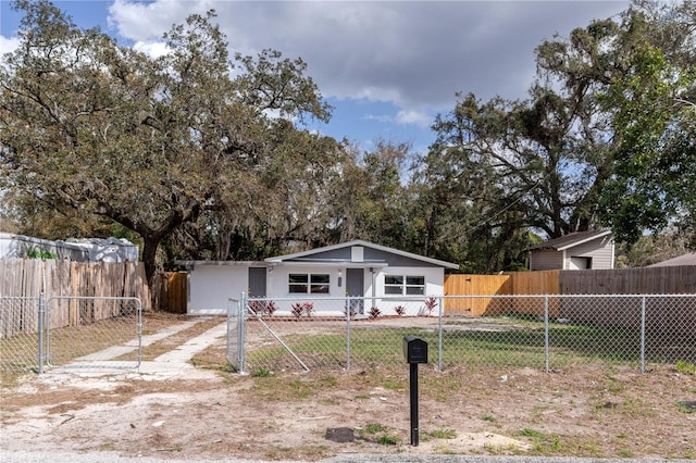 single story home with a fenced front yard