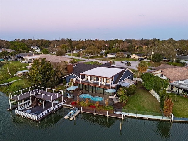 aerial view featuring a residential view and a water view