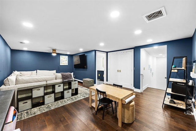 bedroom with dark wood-type flooring, recessed lighting, and visible vents