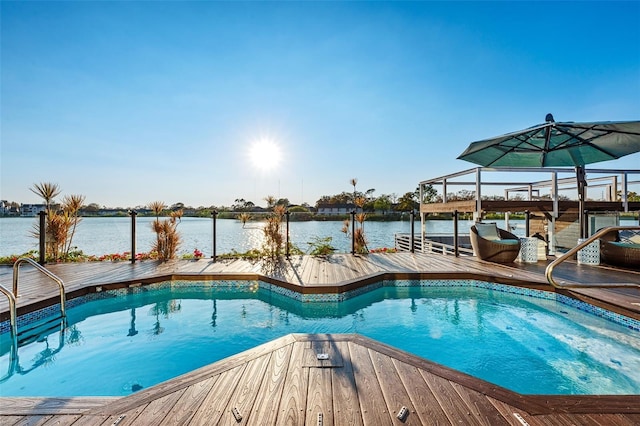 outdoor pool featuring a water view