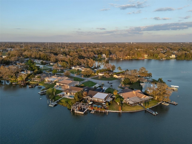 aerial view with a water view, a residential view, and a view of trees