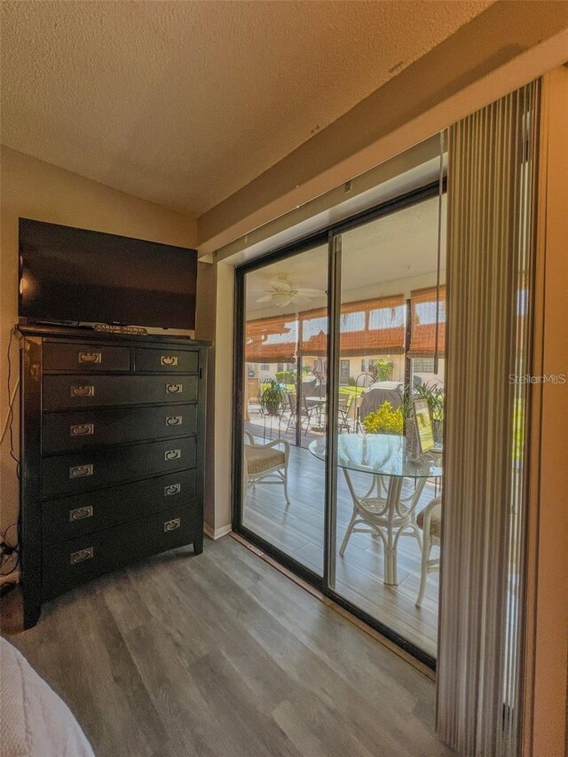 entryway featuring a textured ceiling and wood finished floors