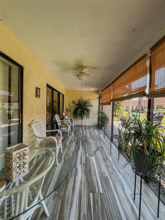 deck featuring outdoor dining area and a ceiling fan