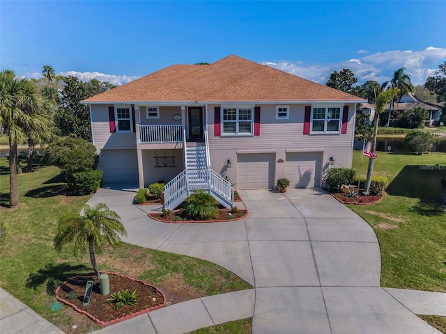 coastal inspired home with driveway, stairway, an attached garage, covered porch, and a front lawn