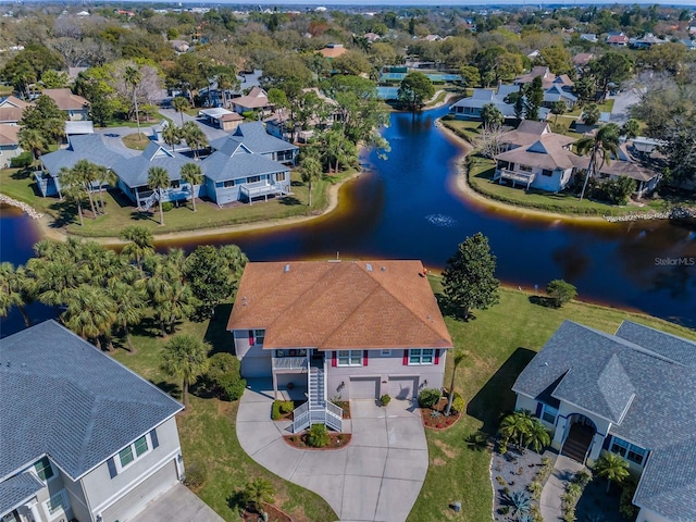 bird's eye view with a residential view and a water view