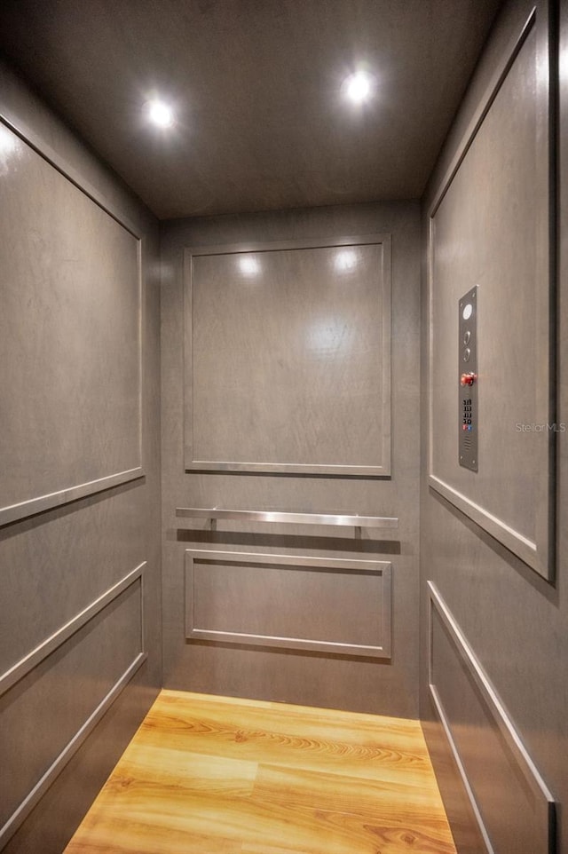 room details featuring elevator and recessed lighting