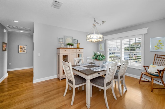 dining space featuring a chandelier, recessed lighting, visible vents, baseboards, and light wood-type flooring