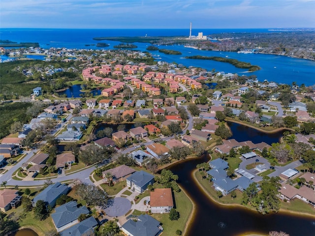 birds eye view of property with a residential view and a water view