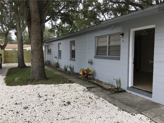 view of side of property featuring fence