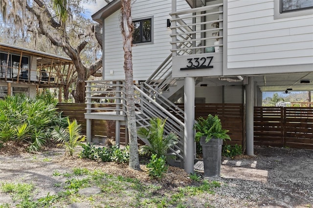 exterior space with fence and stairs