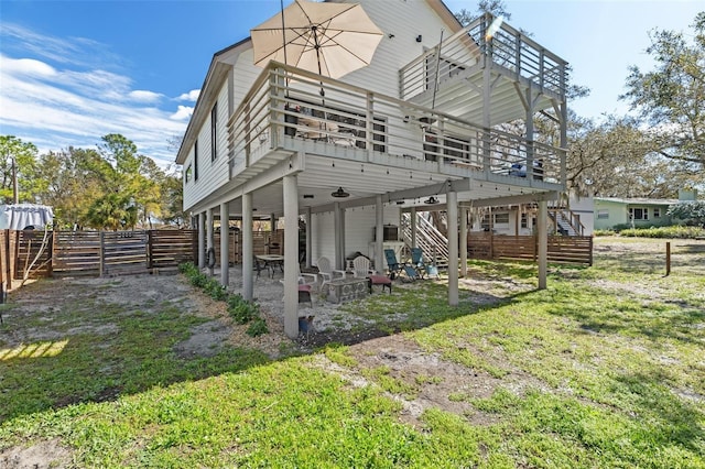 rear view of property with stairs, fence, a deck, and a patio