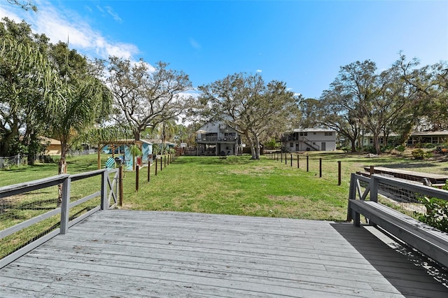 deck featuring a yard and fence