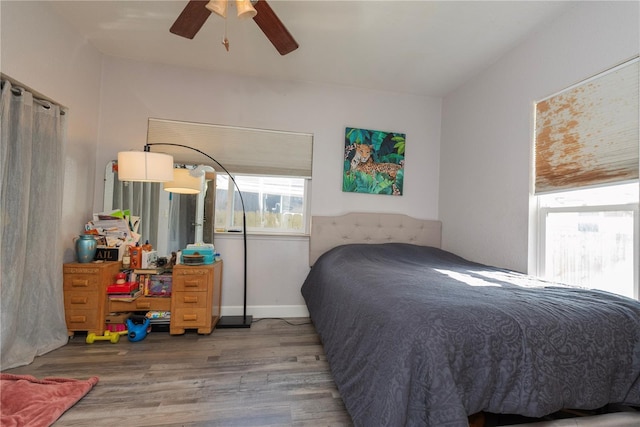 313 Jefferson Ave S, Oldsmar, FL 34677 - bedroom featuring baseboards, wood finished floors, and a ceiling fan