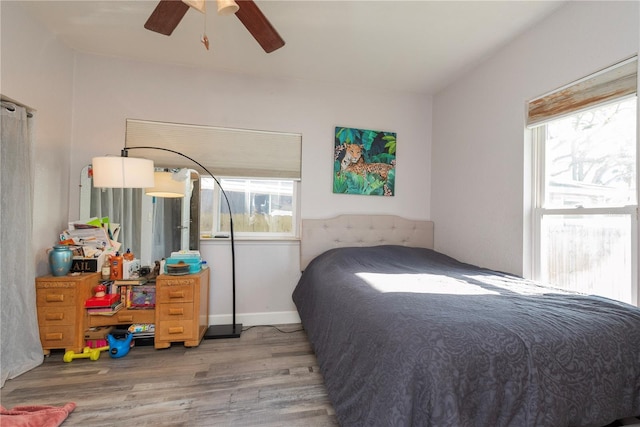 313 Jefferson Ave S, Oldsmar, FL 34677 - bedroom featuring a ceiling fan, baseboards, and wood finished floors