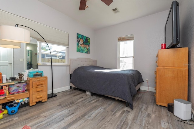 313 Jefferson Ave S, Oldsmar, FL 34677 - bedroom with multiple windows, visible vents, light wood-type flooring, and baseboards