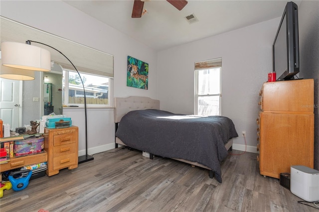 313 Jefferson Ave S, Oldsmar, FL 34677 - bedroom featuring visible vents, baseboards, wood finished floors, and a ceiling fan