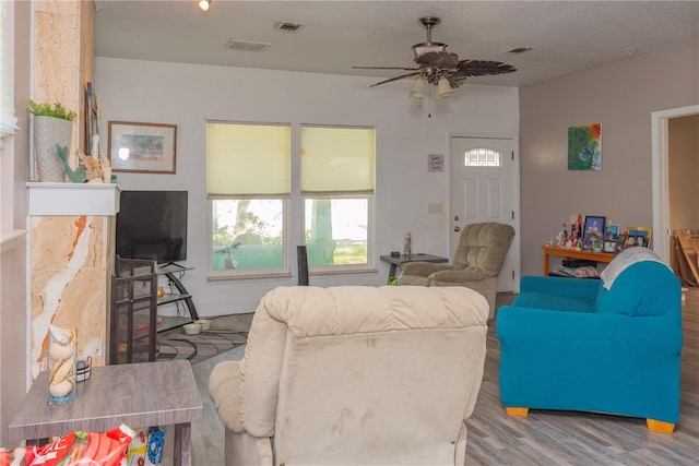 313 Jefferson Ave S, Oldsmar, FL 34677 - living area featuring visible vents, wood finished floors, and a ceiling fan