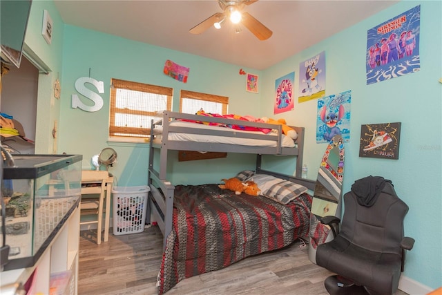 313 Jefferson Ave S, Oldsmar, FL 34677 - bedroom featuring a ceiling fan and wood finished floors
