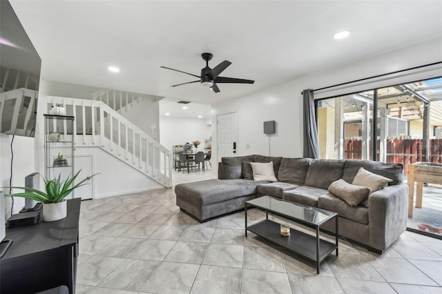 living area featuring a ceiling fan, recessed lighting, stairway, and light tile patterned floors