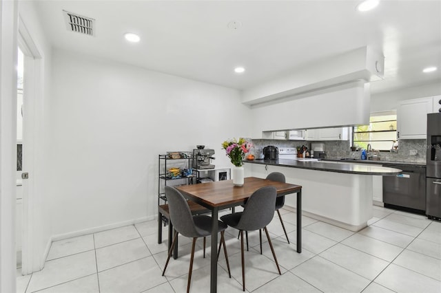 dining area featuring light tile patterned floors, visible vents, and recessed lighting