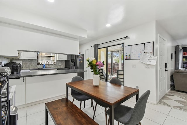 dining area with recessed lighting and light tile patterned floors