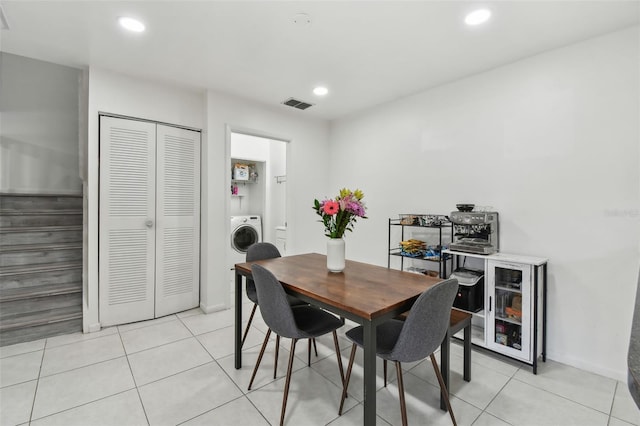 dining room featuring light tile patterned floors, washer / dryer, visible vents, and recessed lighting