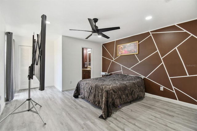 bedroom featuring ceiling fan, connected bathroom, recessed lighting, wood finished floors, and baseboards