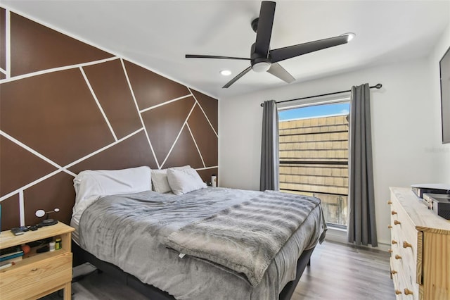 bedroom featuring a ceiling fan, recessed lighting, and wood finished floors