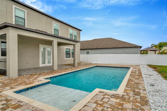 view of pool featuring a patio, french doors, a fenced backyard, and a fenced in pool