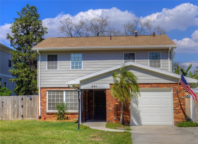 view of front of property with a garage, brick siding, fence, driveway, and a front yard