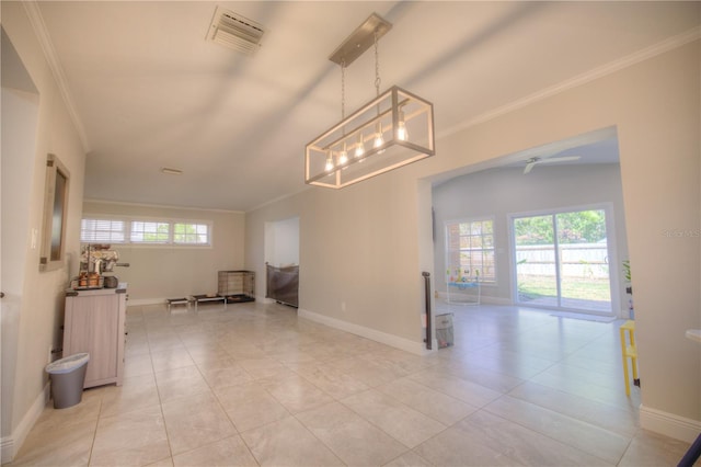 interior space featuring baseboards, visible vents, and ornamental molding