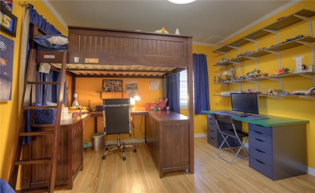 office with light wood-style flooring, baseboards, and crown molding