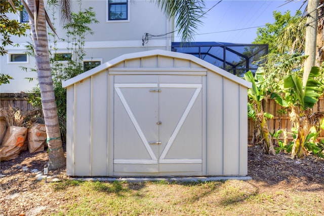 view of shed with fence