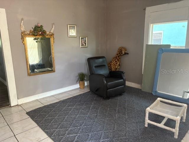 2410 Harper St, Tampa, FL 33605 - living area featuring baseboards and tile patterned flooring