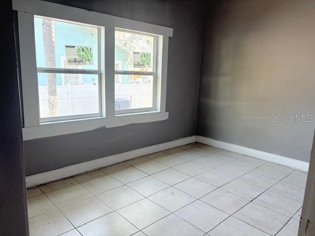 2410 Harper St, Tampa, FL 33605 - unfurnished room with baseboards and light tile patterned flooring