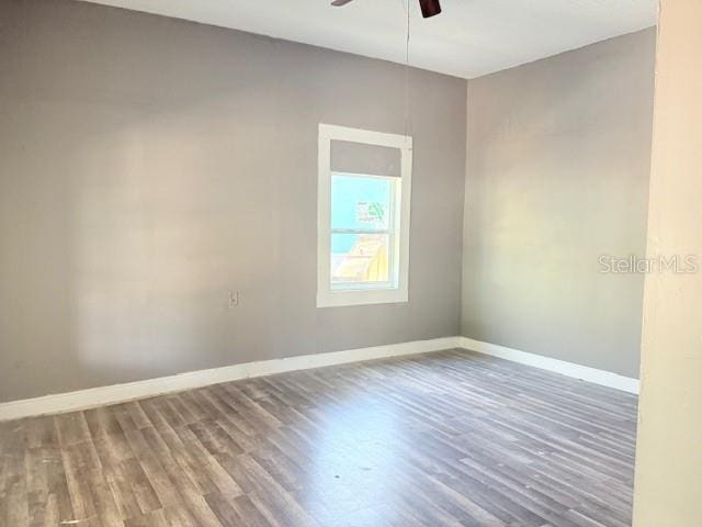 2410 Harper St, Tampa, FL 33605 - empty room featuring baseboards, wood finished floors, and a ceiling fan