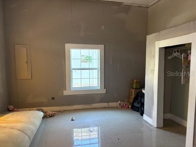 2410 Harper St, Tampa, FL 33605 - bedroom featuring baseboards, a closet, electric panel, and a towering ceiling