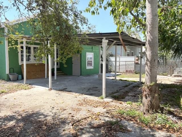2410 Harper St, Tampa, FL 33605 - view of patio with an attached carport