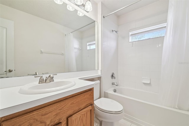 bathroom featuring shower / tub combo, vanity, and toilet