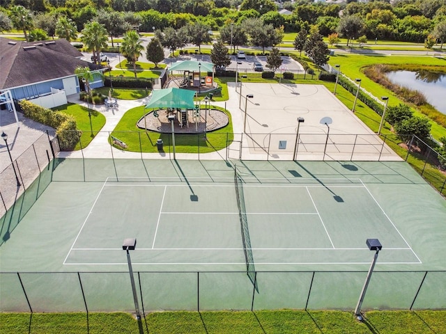 view of tennis court featuring fence