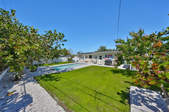 view of yard featuring a fenced in pool, fence private yard, and a patio area