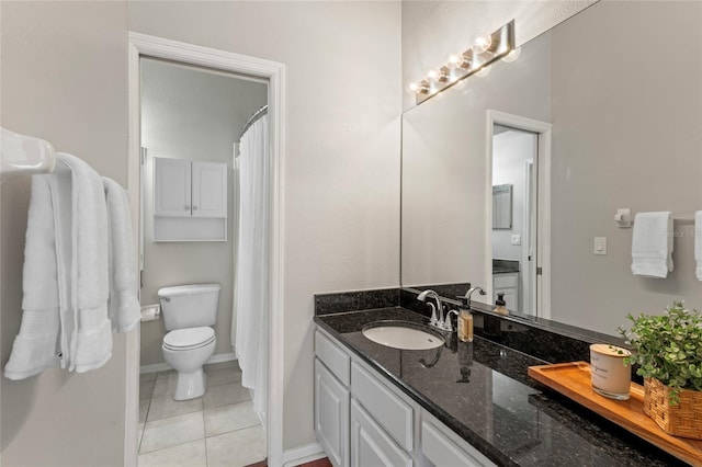 bathroom featuring tile patterned flooring, baseboards, toilet, a shower with shower curtain, and vanity