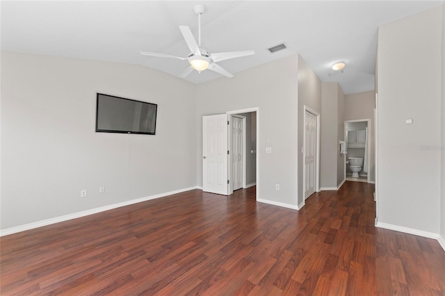 interior space with visible vents, baseboards, ceiling fan, lofted ceiling, and wood finished floors