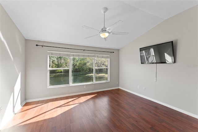 unfurnished room featuring ceiling fan, baseboards, lofted ceiling, and wood finished floors