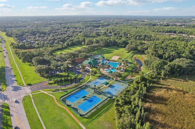 birds eye view of property featuring a wooded view